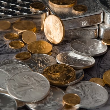 Gold & Silver Pile with American Silver Eagles and Silver Bars and American Gold Eagles