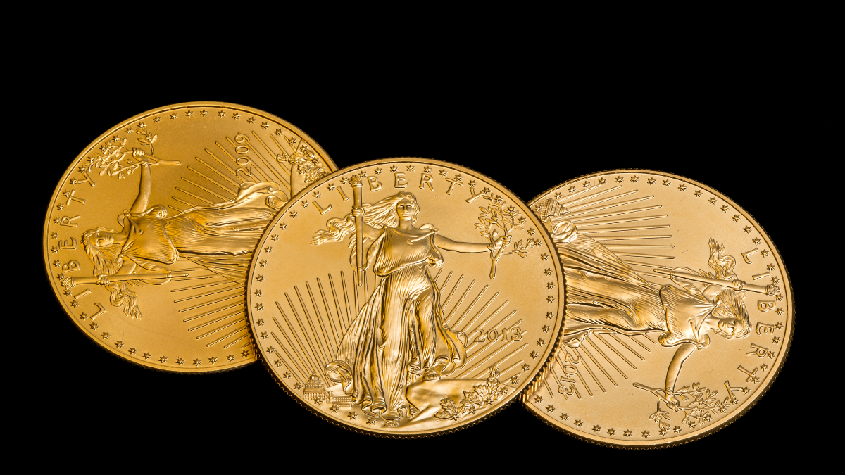 American Gold Eagle coins featuring Lady Liberty design arranged against a black background representing popular gold bullion coins.